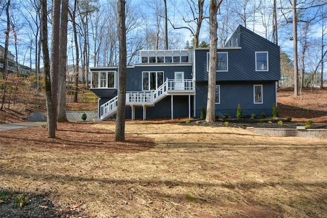 back of property featuring a sunroom