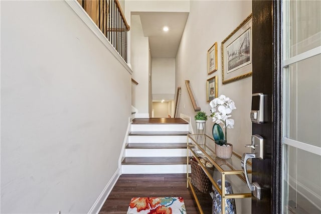 stairs with hardwood / wood-style floors