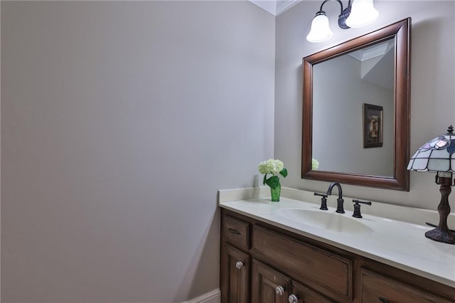 bathroom featuring ornamental molding and vanity