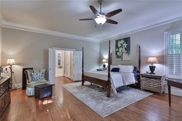 bedroom with dark hardwood / wood-style floors, ornamental molding, and ceiling fan