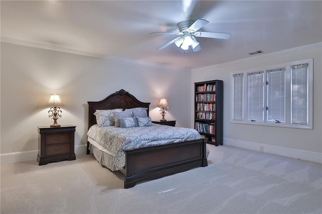 bedroom with ceiling fan, crown molding, and light colored carpet