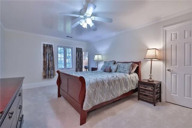 bedroom featuring ceiling fan, crown molding, and light colored carpet