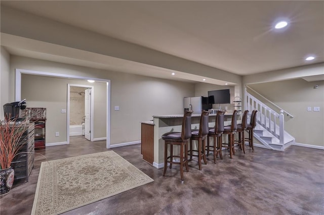 dining area featuring bar