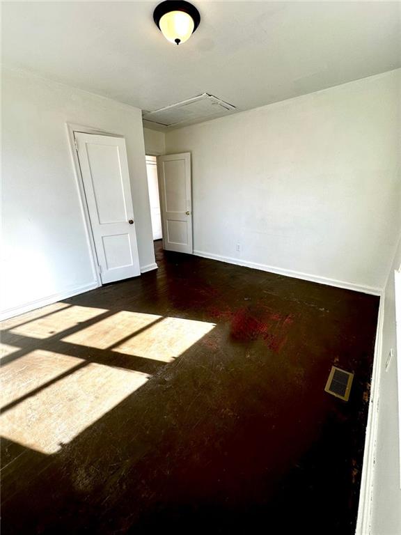 spare room with visible vents and baseboards