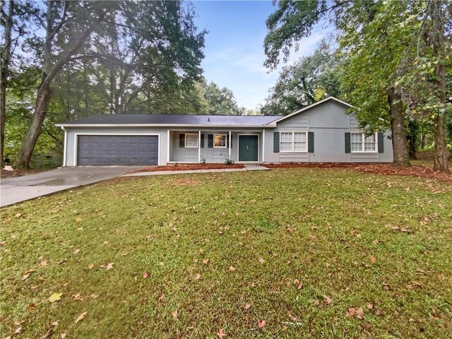 single story home with a front yard and a garage