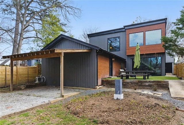 exterior space with driveway and fence