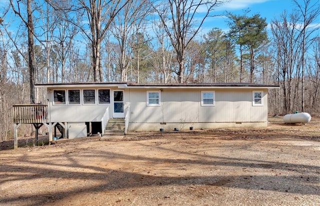 view of front of home with a wooden deck