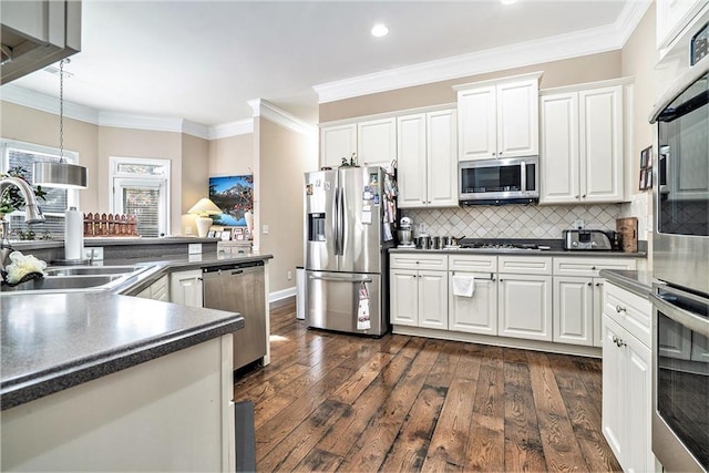 kitchen with white cabinetry, dark hardwood / wood-style flooring, stainless steel appliances, and sink