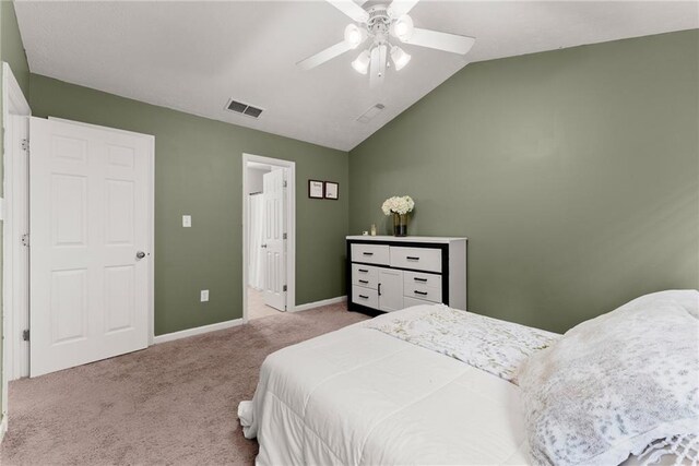 carpeted bedroom featuring visible vents, baseboards, ceiling fan, and lofted ceiling