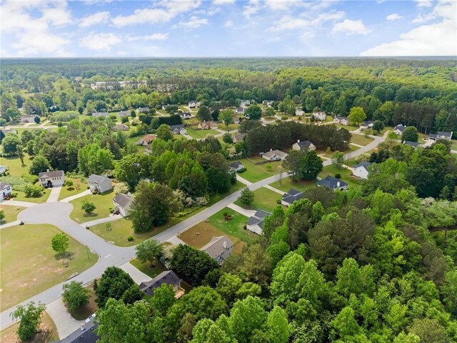 birds eye view of property with a forest view