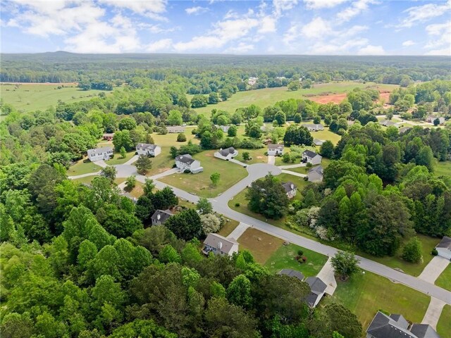 bird's eye view featuring a view of trees