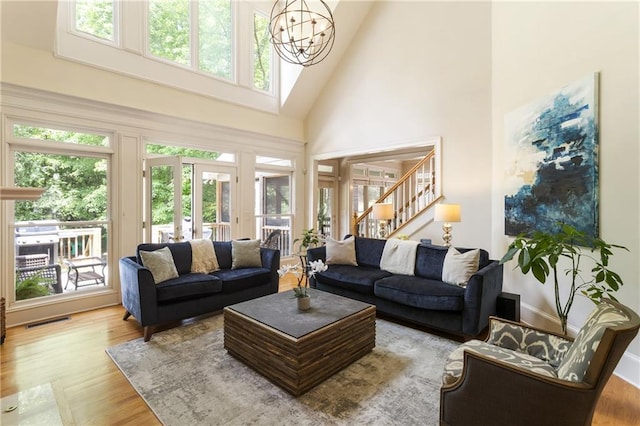 4404 Old Georgetown Trl, Atlanta, GA 30338 - living area with a towering ceiling, stairway, wood finished floors, and a chandelier