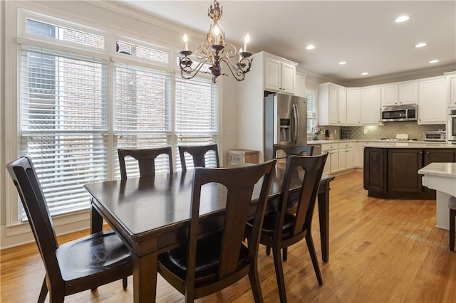 4404 Old Georgetown Trl, Atlanta, GA 30338 - dining space with a chandelier, plenty of natural light, light wood-style floors, crown molding, and recessed lighting