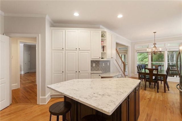 4404 Old Georgetown Trl, Atlanta, GA 30338 - kitchen featuring light wood-style floors, white cabinets, baseboards, a chandelier, and open shelves