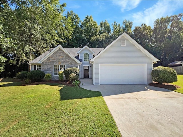 ranch-style home featuring a garage and a front yard