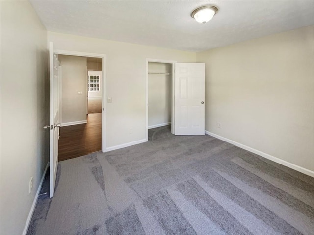 unfurnished bedroom featuring carpet flooring and a closet