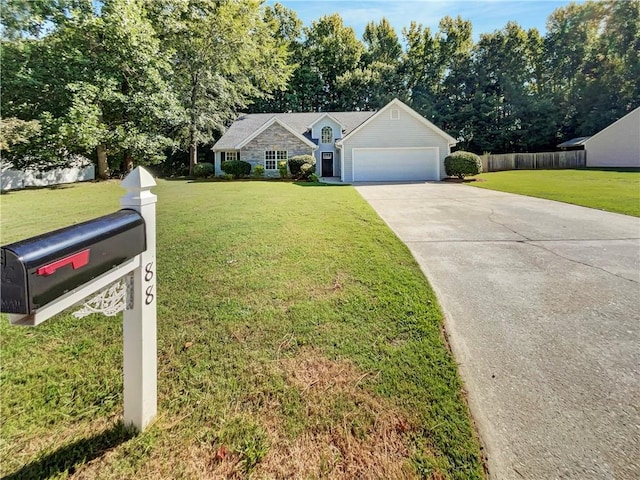 ranch-style house featuring a garage and a front yard