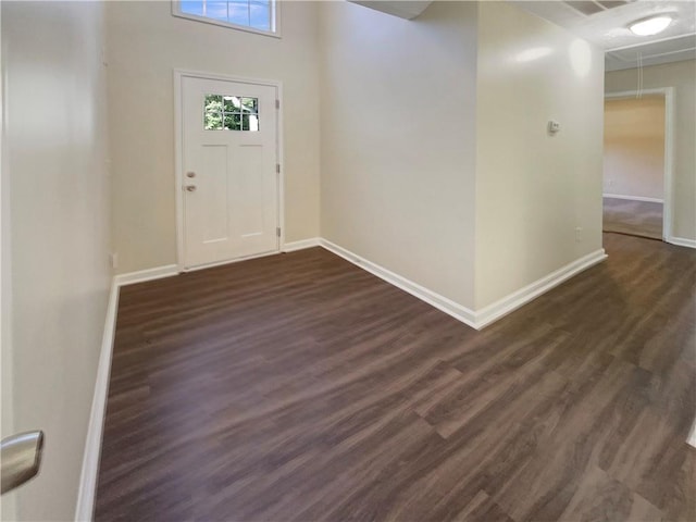 entryway with dark wood-type flooring