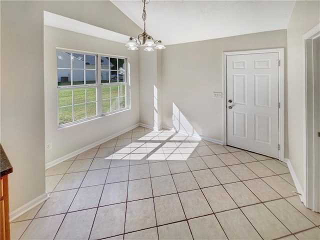 unfurnished dining area featuring vaulted ceiling, light tile patterned floors, and a notable chandelier