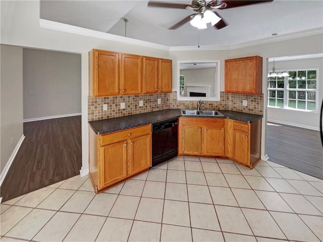 kitchen with sink, light tile patterned floors, backsplash, black dishwasher, and ornamental molding