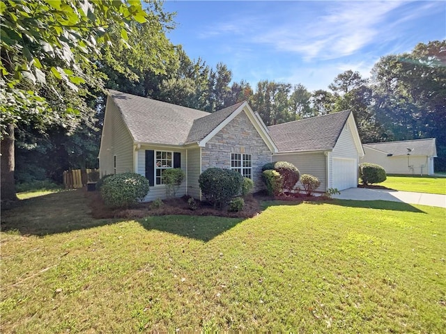 view of front of property with a garage and a front lawn