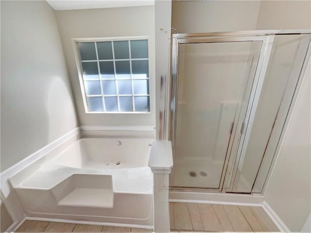 bathroom with separate shower and tub