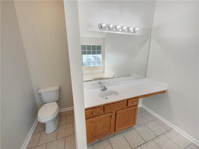 bathroom with vanity, tile patterned floors, and toilet