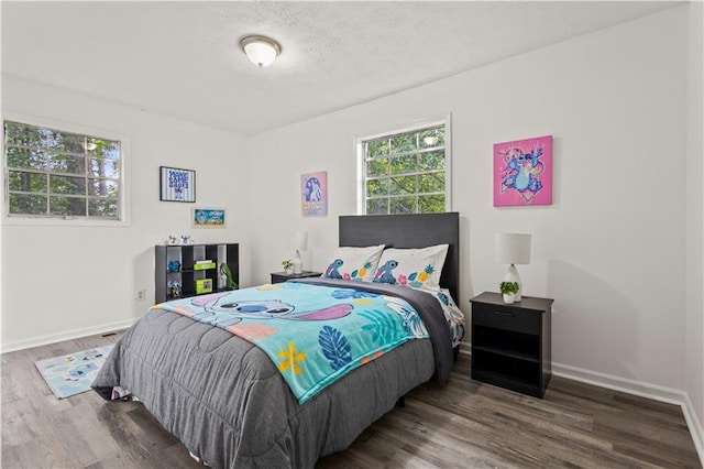 4781 Brownsville Rd, Powder Springs, GA 30127 - bedroom featuring multiple windows, wood finished floors, and baseboards