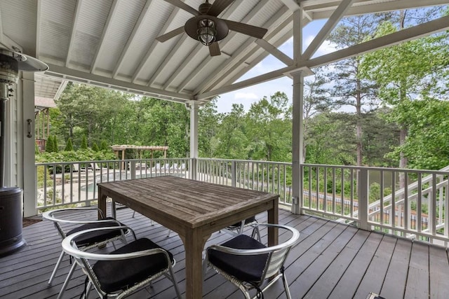 wooden deck with a ceiling fan