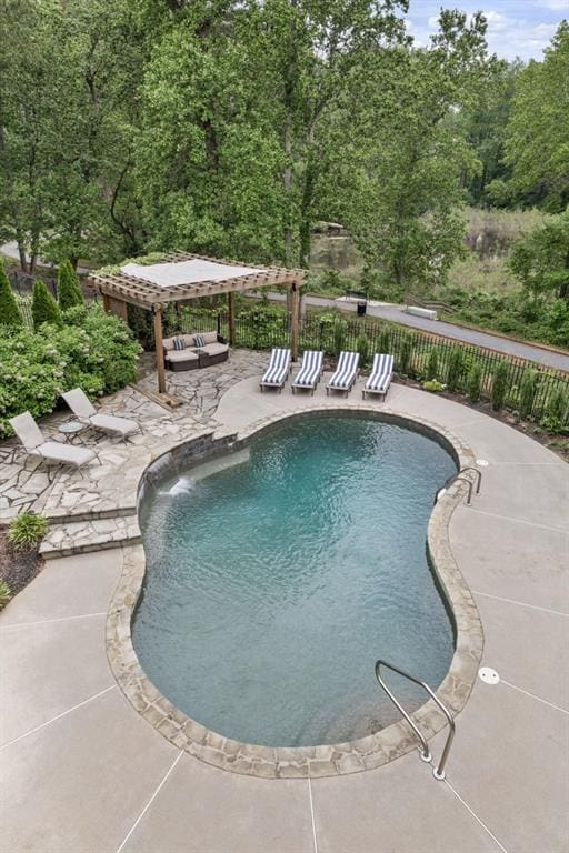 view of pool with a fenced in pool, a patio area, fence, and a pergola