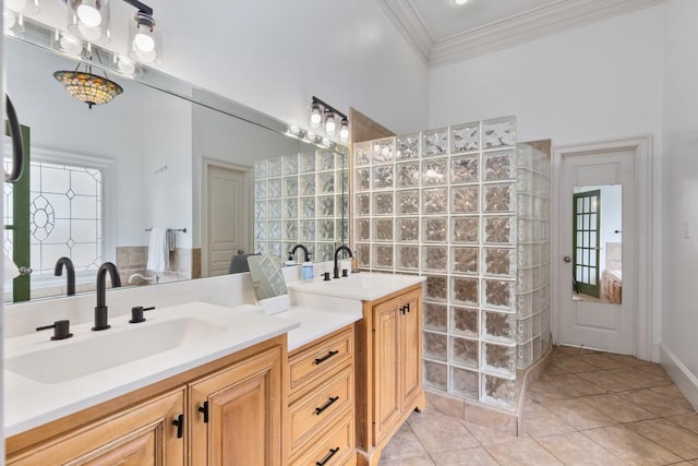 bathroom with a walk in shower, ornamental molding, tile patterned flooring, and vanity