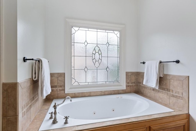 full bath featuring a jetted tub and plenty of natural light