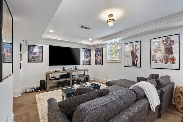 home theater room featuring visible vents, ornamental molding, baseboards, and recessed lighting
