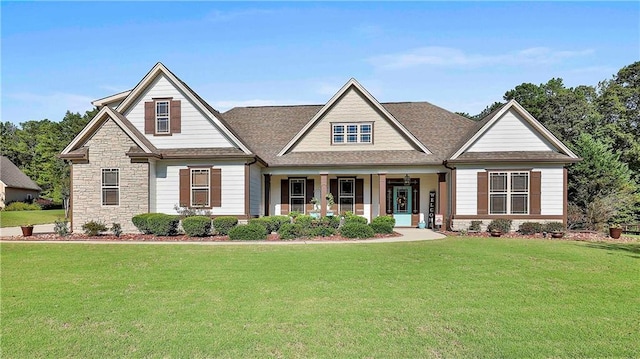 craftsman house with a front lawn and a porch