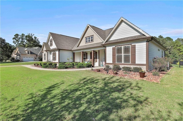 craftsman-style house featuring a front lawn and covered porch