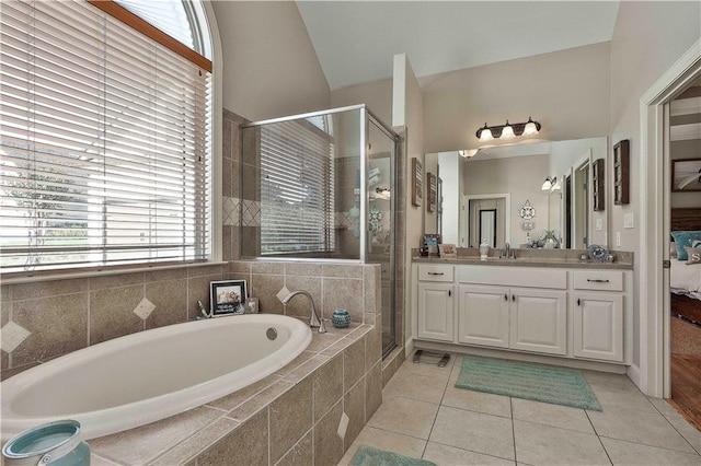 bathroom with tile patterned flooring, vanity, lofted ceiling, and shower with separate bathtub