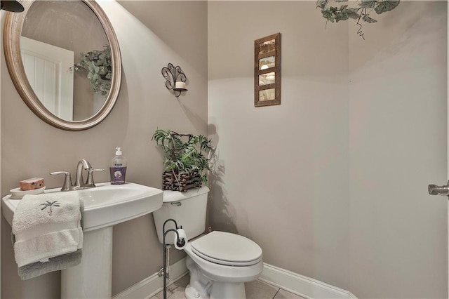 bathroom featuring tile patterned flooring and toilet