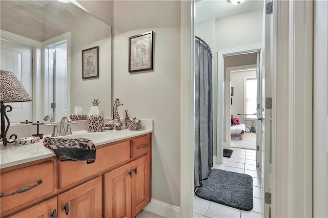 bathroom featuring tile patterned flooring and vanity