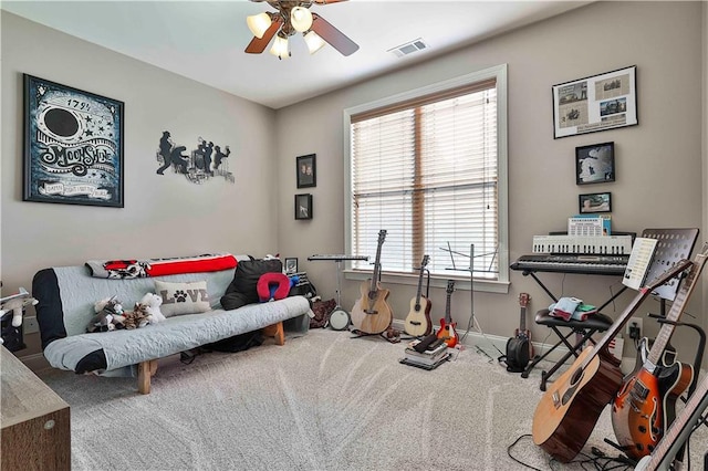 interior space with carpet floors and ceiling fan