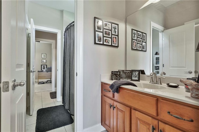 bathroom with tile patterned floors and vanity