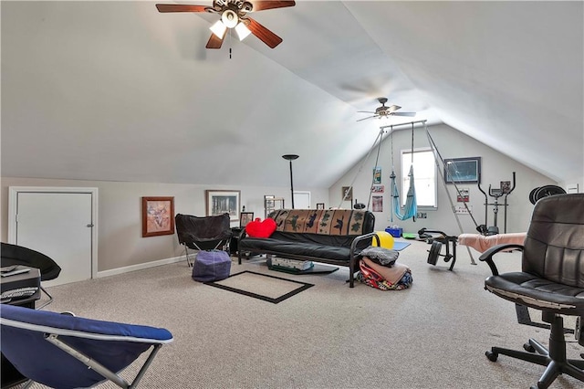 interior space with ceiling fan, carpet floors, and vaulted ceiling