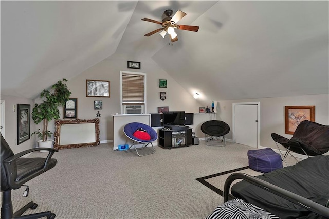 carpeted office with ceiling fan and vaulted ceiling