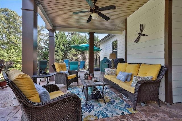 view of patio / terrace with an outdoor living space and ceiling fan