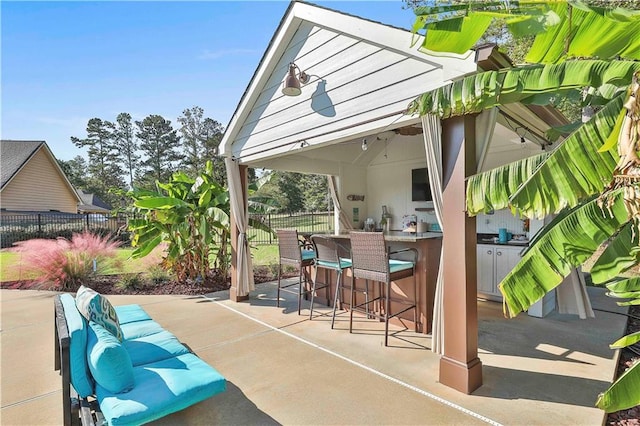 view of patio / terrace featuring an outdoor living space and a bar