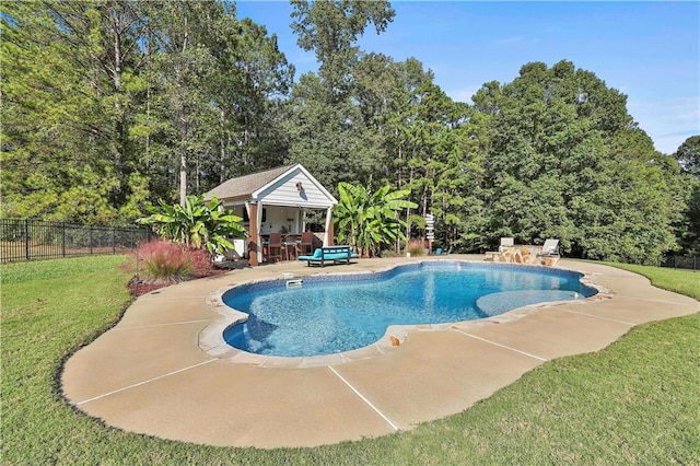 view of swimming pool featuring a yard and a patio