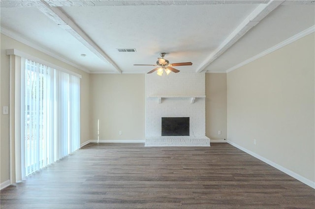 unfurnished living room featuring dark wood-type flooring, ceiling fan, a fireplace, and beam ceiling