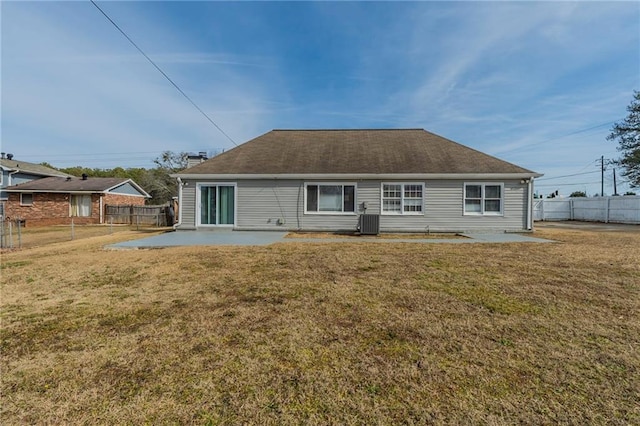 back of house featuring a yard, a patio, and central air condition unit