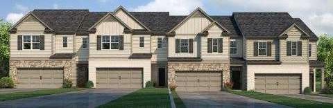 multi unit property featuring stone siding, driveway, and an attached garage