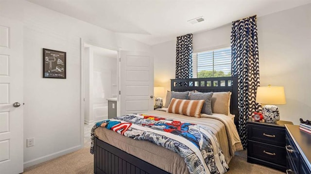 bedroom with visible vents, light colored carpet, and baseboards