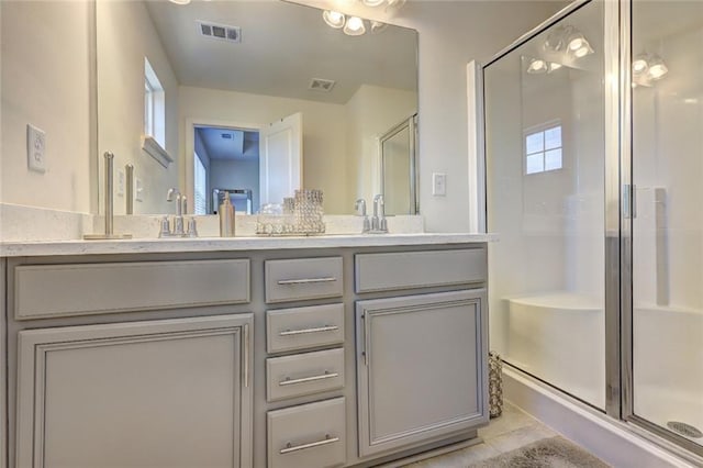 1005 Belfry Ter, Fairburn, GA 30213 - bathroom with a stall shower, double vanity, and tile patterned flooring